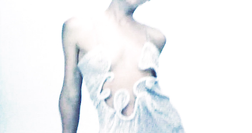 Fall 22 Video stills — Kelsey Martinovich wears the Warped Sequin Venus Dress